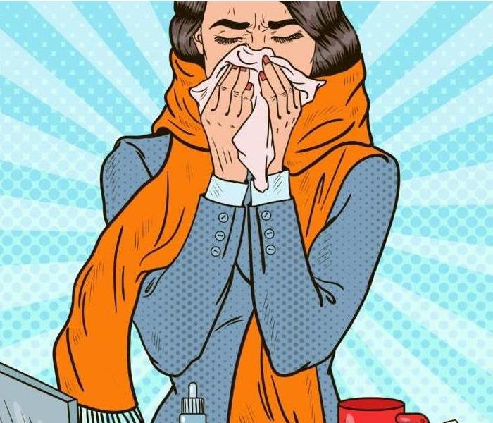 woman sneezing in a tissue